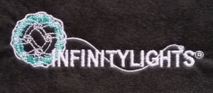 Image of final embroidered logo with white thread on black - Seattle