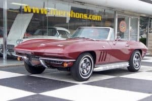 Photo of burgundy vintage Corvette at dealer