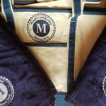 Image of custom embroidered towels and beach bags