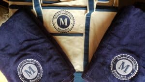 Image of custom embroidered towels and beach bags
